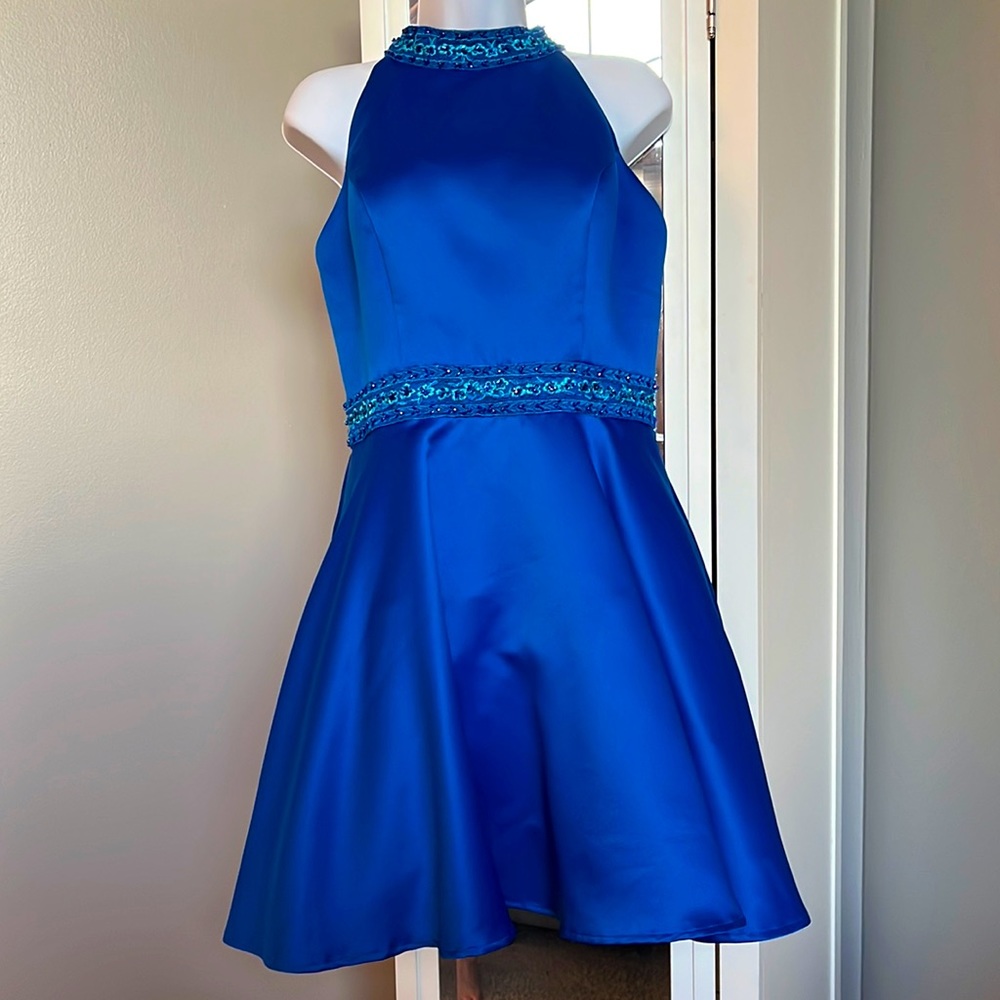 Mori Lee blue halter dress with pockets.